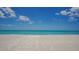 Expansive view of a pristine, white sand beach at 603 Longboat Club Rd # 602N, Longboat Key, FL 34228
