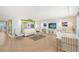 Spacious living room with ocean view, white sofa, and modern decor at 603 Longboat Club Rd # 602N, Longboat Key, FL 34228