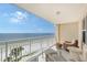 Relax on this furnished balcony overlooking the ocean at 603 Longboat Club Rd # 602N, Longboat Key, FL 34228