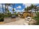 Outdoor kitchen and patio area with seating; perfect for grilling and entertaining at 603 Longboat Club Rd # 602N, Longboat Key, FL 34228