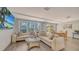 Relaxing community room with comfortable sofas, large TV, and ample seating at 603 Longboat Club Rd # 602N, Longboat Key, FL 34228