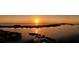 Stunning sunset over the water and waterfront homes at 603 Longboat Club Rd # 602N, Longboat Key, FL 34228