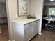 White kitchen cabinets and countertops with a breakfast bar area at 3600 Lake Bayshore Drive Bld. K # 221, Bradenton, FL 34205