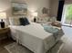 Spacious bedroom with a queen-size bed and stylish decor at 3600 Lake Bayshore Drive Bld. K # 221, Bradenton, FL 34205