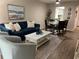 Bright living room with comfy seating, coffee table, and hardwood floors at 3600 Lake Bayshore Drive Bld. K # 221, Bradenton, FL 34205