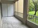 Spacious screened balcony overlooking a backyard at 3600 Lake Bayshore Drive Bld. K # 221, Bradenton, FL 34205