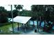 Waterfront pavilion with picnic tables at 4003 Twin Rivers Trl, Parrish, FL 34219