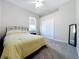 Bright bedroom with double bed, carpet, and double door closet at 4003 Twin Rivers Trl, Parrish, FL 34219