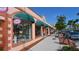 Quaint shops line the street, featuring colorful awnings and unique storefronts, adding charm at 4995 Pepperwood Pl, Venice, FL 34293