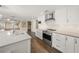 Modern kitchen featuring stainless steel appliances and white shaker cabinets at 3556 E Forest Lake Dr, Sarasota, FL 34232
