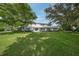 Two story home with lush lawn and landscaping at 3556 E Forest Lake Dr, Sarasota, FL 34232