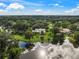 Stunning aerial view of the property and its lush surroundings at 3556 E Forest Lake Dr, Sarasota, FL 34232