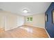 Bright bedroom with hardwood floors and a spacious closet at 3556 E Forest Lake Dr, Sarasota, FL 34232
