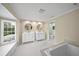 Elegant bathroom with double vanity, soaking tub, and window at 3556 E Forest Lake Dr, Sarasota, FL 34232