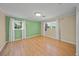 Well-lit bedroom, featuring hardwood floors and neutral walls at 3556 E Forest Lake Dr, Sarasota, FL 34232