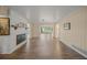 Living area with hardwood floors, fireplace and view to Gathering room at 3556 E Forest Lake Dr, Sarasota, FL 34232