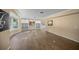 Living room with built-in shelving and hardwood floors at 3556 E Forest Lake Dr, Sarasota, FL 34232