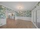 Dining room with leafy wallpaper and access to kitchen at 3556 E Forest Lake Dr, Sarasota, FL 34232