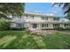 Two story home with stone walkway and landscaping at 3556 E Forest Lake Dr, Sarasota, FL 34232