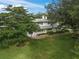 Single-story home with stone walkway and landscaped yard at 3556 E Forest Lake Dr, Sarasota, FL 34232
