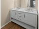 Double vanity bathroom with modern finishes at 3556 E Forest Lake Dr, Sarasota, FL 34232
