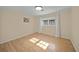 Spacious bedroom with hardwood floors and large windows at 3556 E Forest Lake Dr, Sarasota, FL 34232