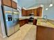 Kitchen with stainless steel appliances and granite countertops at 13311 50Th E Ln, Parrish, FL 34219