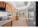 Well-equipped kitchen with wood cabinets, stainless steel appliances, and breakfast nook at 13180 Ipolita St, Venice, FL 34293