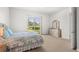 Comfortable bedroom with sliding door access to backyard at 13180 Ipolita St, Venice, FL 34293