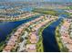 Aerial view showcasing a large waterfront community at 13180 Ipolita St, Venice, FL 34293