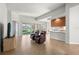 Spacious living room with tile floors, access to the kitchen and backyard at 13180 Ipolita St, Venice, FL 34293
