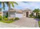 One-story home with tile roof and paver driveway at 13180 Ipolita St, Venice, FL 34293