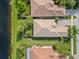 Aerial view of single-Gathering home with tile roof, located in a residential community at 13180 Ipolita St, Venice, FL 34293