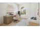 Home office with built-in desk and a comfortable sitting area at 13180 Ipolita St, Venice, FL 34293