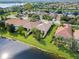 Aerial view of a beautiful community with lakefront homes at 13180 Ipolita St, Venice, FL 34293