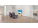 Relaxing Gathering room with two leather recliners and large TV at 13180 Ipolita St, Venice, FL 34293