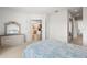Main bedroom with dresser and access to the kitchen at 13180 Ipolita St, Venice, FL 34293