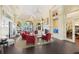 Spacious clubhouse lounge with comfortable seating and fireplace at 13180 Ipolita St, Venice, FL 34293