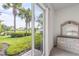 Bedroom with view of the backyard and lake at 13180 Ipolita St, Venice, FL 34293