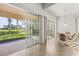 Bright dining area with sliding doors leading to backyard at 13180 Ipolita St, Venice, FL 34293