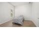 Small bedroom with gray chevron bedding and a window at 13180 Ipolita St, Venice, FL 34293