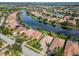 Aerial view of single-Gathering home with water view in upscale community at 13180 Ipolita St, Venice, FL 34293