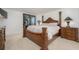 Main bedroom with a large wooden bed and nightstands at 5760 Midnight Pass Rd # 702, Sarasota, FL 34242