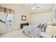 Spacious bedroom with high ceilings, large closet, and carpeted floor at 4995 Pepperwood Pl, Venice, FL 34293