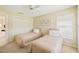 Bright bedroom with two twin beds and window at 4995 Pepperwood Pl, Venice, FL 34293
