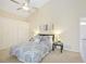 Main bedroom with high ceilings, large closet, and ensuite bathroom access at 4995 Pepperwood Pl, Venice, FL 34293