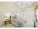 Spacious bedroom with high ceilings, large closet, and ensuite bathroom access at 4995 Pepperwood Pl, Venice, FL 34293