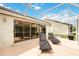 Spacious screened patio with lounge chairs and sliding glass doors at 4995 Pepperwood Pl, Venice, FL 34293