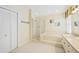 Clean bathroom with shower and soaking tub at 4995 Pepperwood Pl, Venice, FL 34293
