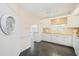 White kitchen with granite countertops and view to backyard at 4995 Pepperwood Pl, Venice, FL 34293